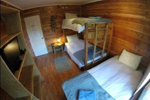 Postel nebo postele na pokoji v ubytování Hotel Andes Pucón