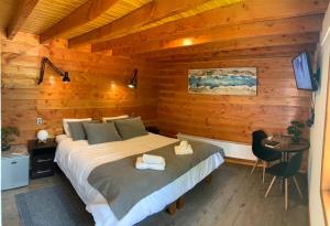 Postel nebo postele na pokoji v ubytování Hotel Andes Pucón