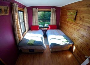 Postel nebo postele na pokoji v ubytování Hotel Andes Pucón