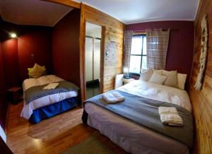 Postel nebo postele na pokoji v ubytování Hotel Andes Pucón