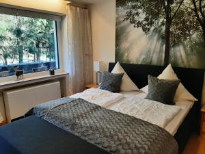 Postel nebo postele na pokoji v ubytování Apartment am Bikepark mit Kamin und Sauna