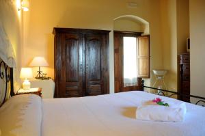 Letto o letti in una camera di Torre Don Virgilio Country Hotel