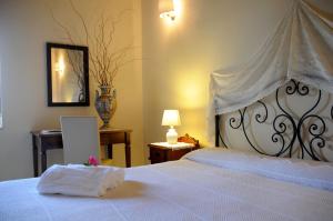 Letto o letti in una camera di Torre Don Virgilio Country Hotel