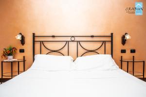 Postel nebo postele na pokoji v ubytování Crabun Hotel