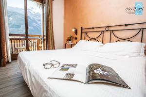 Postel nebo postele na pokoji v ubytování Crabun Hotel