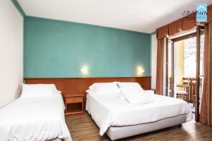 Postel nebo postele na pokoji v ubytování Crabun Hotel