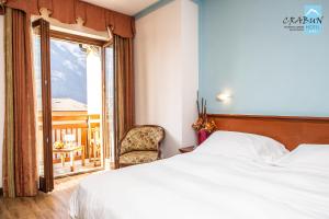 Postel nebo postele na pokoji v ubytování Crabun Hotel