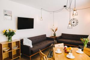 Posedenie v ubytovaní Apartamenty 'Okno z widokiem'