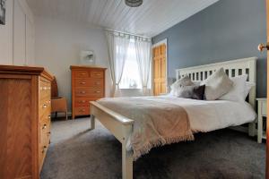 Ένα ή περισσότερα κρεβάτια σε δωμάτιο στο Mole Cottage