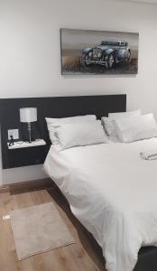 Postel nebo postele na pokoji v ubytování Casa Mo Boutique Guest House