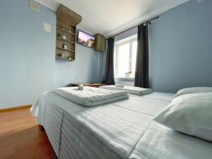 Posteľ alebo postele v izbe v ubytovaní Guest House Lviv