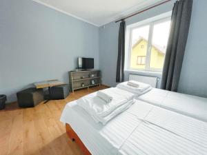 Posteľ alebo postele v izbe v ubytovaní Guest House Lviv