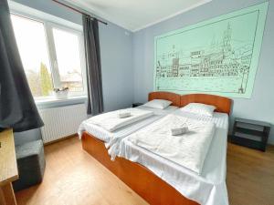 Posteľ alebo postele v izbe v ubytovaní Guest House Lviv