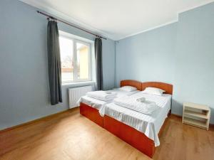 Posteľ alebo postele v izbe v ubytovaní Guest House Lviv