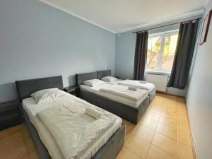 Posteľ alebo postele v izbe v ubytovaní Guest House Lviv