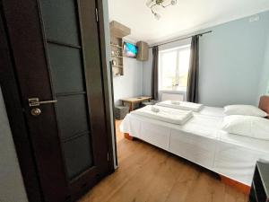 Posteľ alebo postele v izbe v ubytovaní Guest House Lviv