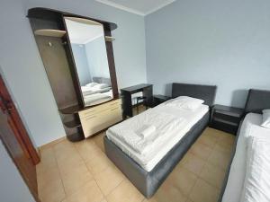 Posteľ alebo postele v izbe v ubytovaní Guest House Lviv