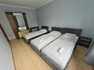 Posteľ alebo postele v izbe v ubytovaní Guest House Lviv