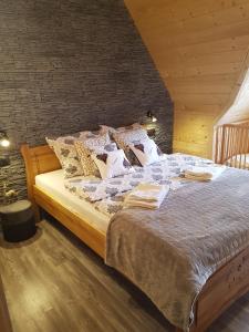 Postel nebo postele na pokoji v ubytování Tatrzańskie Domki