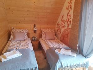 Postel nebo postele na pokoji v ubytování Tatrzańskie Domki