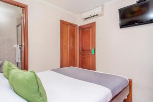 Ένα ή περισσότερα κρεβάτια σε δωμάτιο στο Hotel Costa Linda