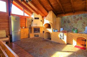 a kitchen with a large brick oven in a house at Pensiunea Aida in Gura Humorului +40 photos