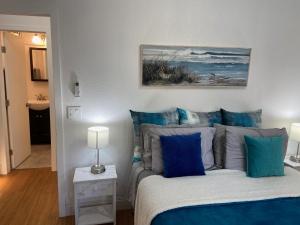 En eller flere senge i et værelse på Mermaid's Cottage