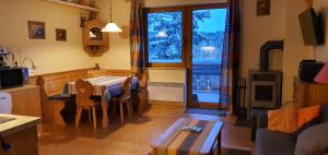 Μια τηλεόραση ή/και κέντρο ψυχαγωγίας στο ALPENFLAIR Appartment mit Aussicht zum träumen