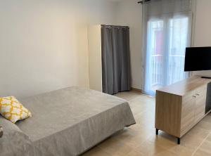 Posteľ alebo postele v izbe v ubytovaní Apartaments l'Escala Centre