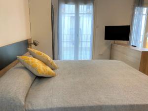 Posteľ alebo postele v izbe v ubytovaní Apartaments l'Escala Centre