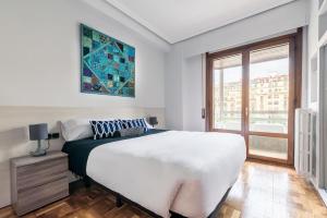 Posteľ alebo postele v izbe v ubytovaní Zurriola Surf