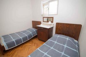 Posteľ alebo postele v izbe v ubytovaní Apartment in Veli Losinj 34684