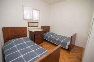 Posteľ alebo postele v izbe v ubytovaní Apartment in Veli Losinj 34684