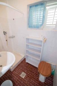 a bathroom with a toilet and a sink at Apartment in Veli Losinj 34684 in Veli Lošinj