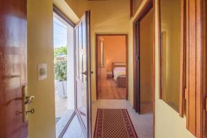 an open door to a room with a bedroom at Apartment in Vrbnik/Island Krk 35825 in Vrbnik