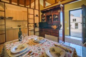 a kitchen with a table with plates on it at Apartment in Vrbnik/Island Krk 35825 in Vrbnik