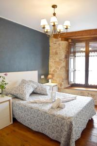 Ένα ή περισσότερα κρεβάτια σε δωμάτιο στο Casa Rural Pinares De Soria