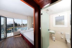 a hotel room with a bed and a bathroom at Best Western Hotel Mediterraneo in Castelldefels +57 photos