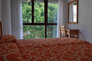 Cama o camas de una habitación en Apartamentos La Reserva Classic Noja