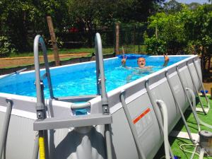 a man is in a swimming pool at Casa La Vigna in Puntalazzo