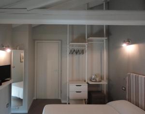 Postel nebo postele na pokoji v ubytování Corte Merighi Charming Rooms
