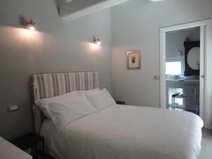 Postel nebo postele na pokoji v ubytování Corte Merighi Charming Rooms