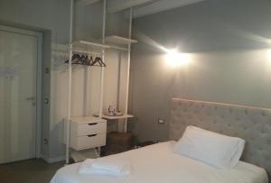 Postel nebo postele na pokoji v ubytování Corte Merighi Charming Rooms