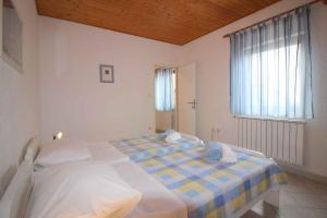 Łóżko lub łóżka w pokoju w obiekcie Apartment in Porec - Istrien 9922