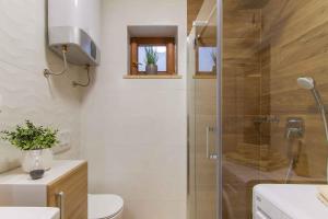 a bathroom with a shower with a toilet and a sink at Apartment in Njivice/Insel Krk 13329 in Njivice