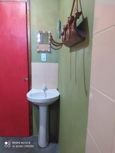 a bathroom with a sink and a mirror at Recanto Bramasole Ilha de Boipeba in Ilha de Boipeba +17 photos