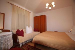 a hotel room with two beds and a window at Apartment in Silo/Insel Krk 13547 in Šilo