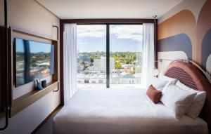 Postel nebo postele na pokoji v ubytování Ovolo South Yarra
