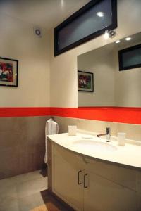 a bathroom with a sink and a mirror at Etna Hut in Nicolosi
