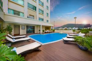 a swimming pool in the middle of a building at Mithrin Hotel Halong in Ha Long